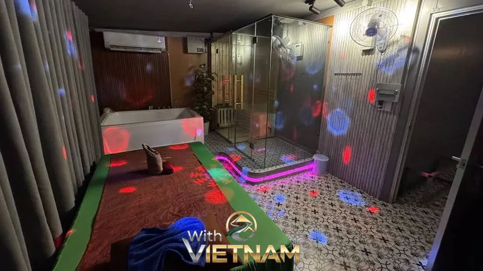 분홍색 조명 욕조가 있는 마사지실