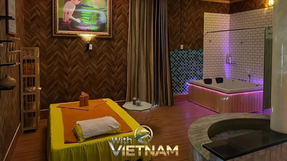 타일 벽과 큰 욕조가 있는 마사지실